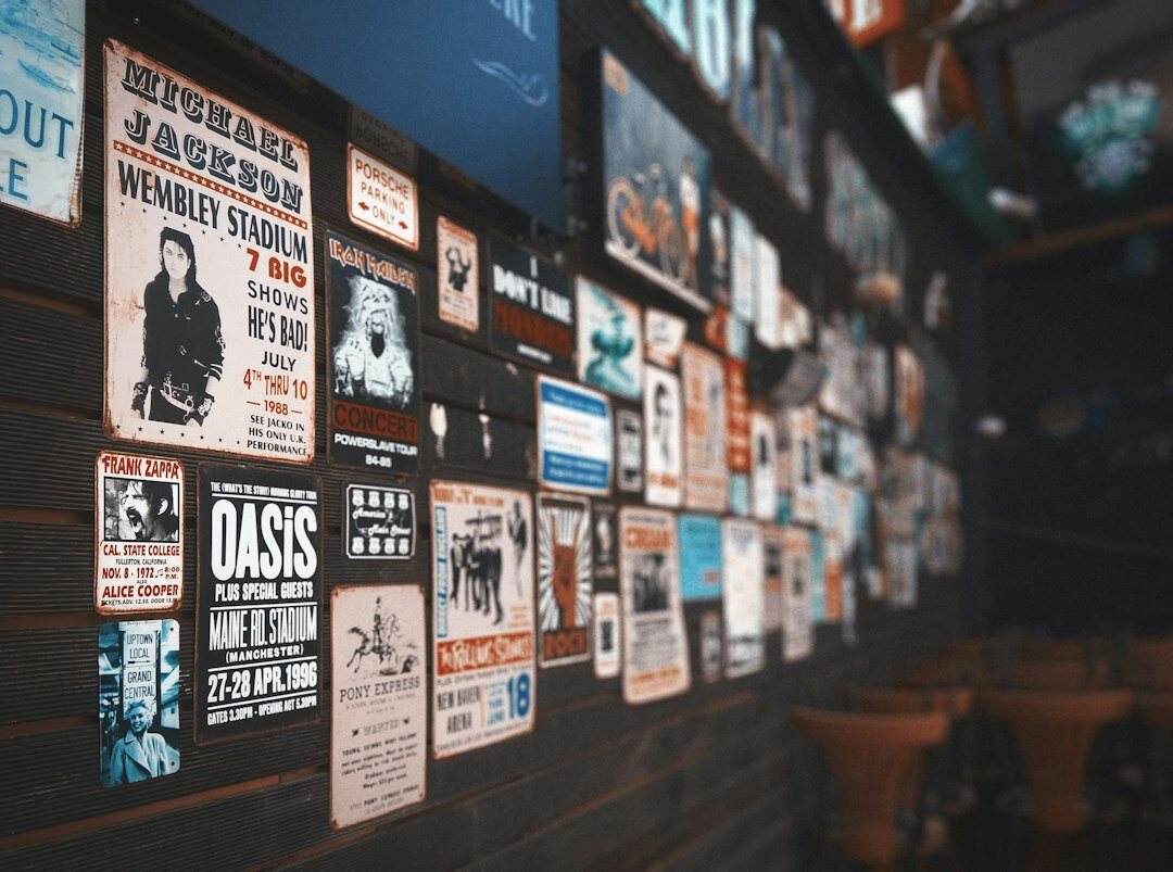 Wall covered with layered vintage advertising posters